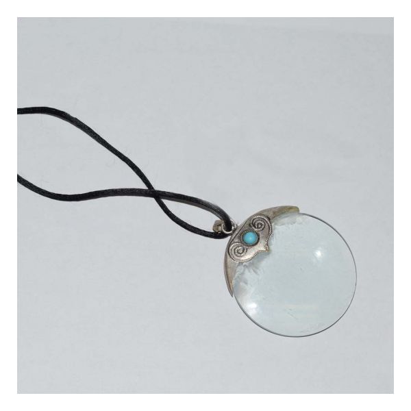 magnifier with a two-inch glass lens and a decorative, silver-tone metal bracket with a turquoise stone, where the black, silk neck cord attaches